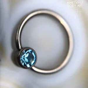 Titanium Captive Bead Ring With 4mm Light Blue CZ