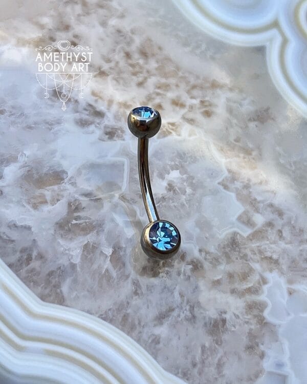 TI Navel Curve - Light Blue CZ Externally Threaded (5mm, 6mm ball)