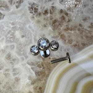Cluster with 3 Bezel set Clear CZ and Titanium Labret.