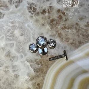 Cluster with 3 Bezel set Clear CZ and Titanium Labret.