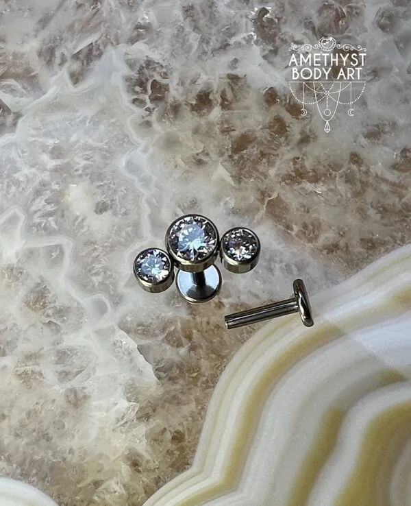 Cluster with 3 Bezel set Clear CZ and Titanium Labret.