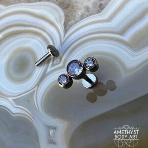 Cluster with 3 Bezel set Purple CZ and Titanium Labret.