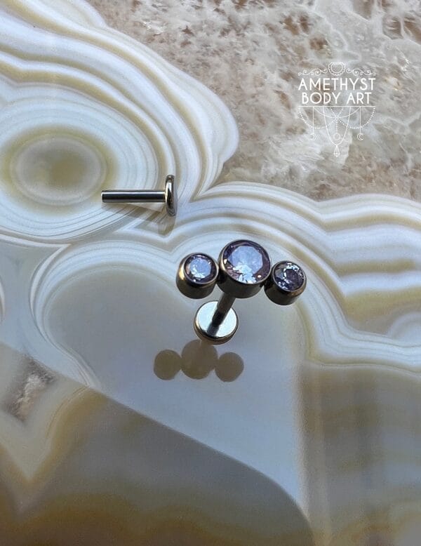Cluster with 3 Bezel set Purple CZ and Titanium Labret. - Image 2