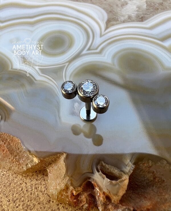 Cluster with 3 Bezel set Clear CZ and Titanium Labret. - Image 2