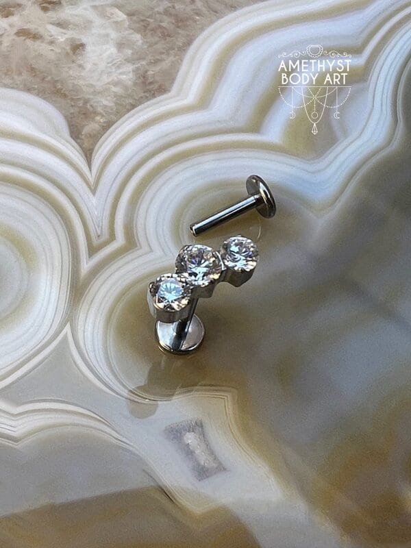 Cluster with 3 Prong set Clear CZ and Titanium Labret.