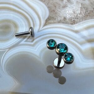 Cluster with 3 Bezel set Green CZ and Titanium Labret.